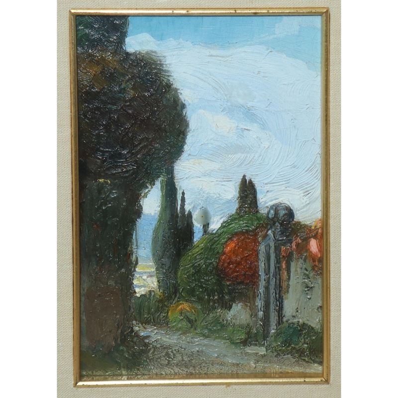 Strada con cipressi