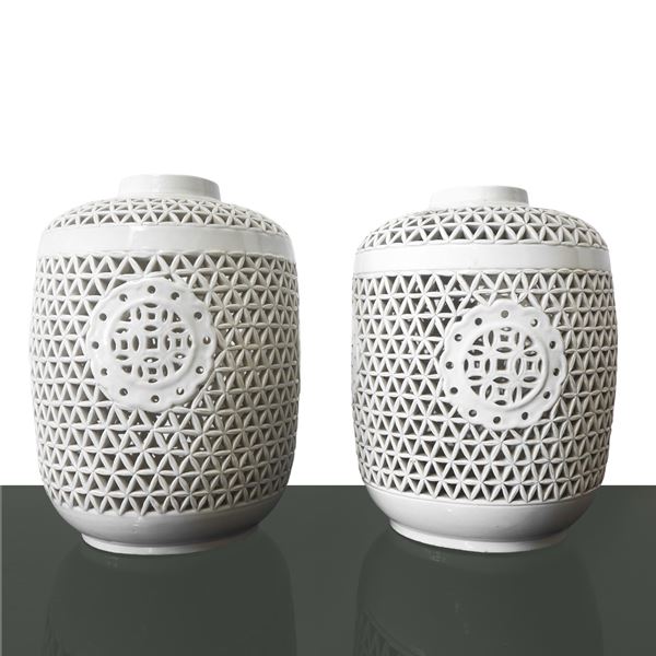 Pair of white perforated majolica vases