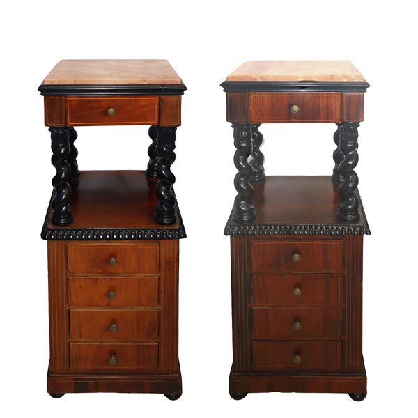 Pair of bedside tables with marble on the top, black ebonized twisted columns, 4 low drawers and flattened onion-shaped threaded feet in light woods