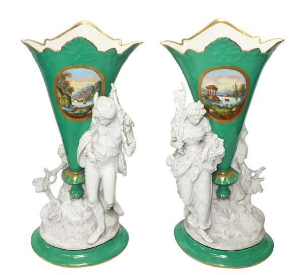 Pair of porcelain vases and biscuit figures and landscape decorations