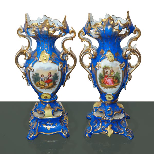 Pair of Louis Philippe porcelain vases in blue and gold with floral decorations