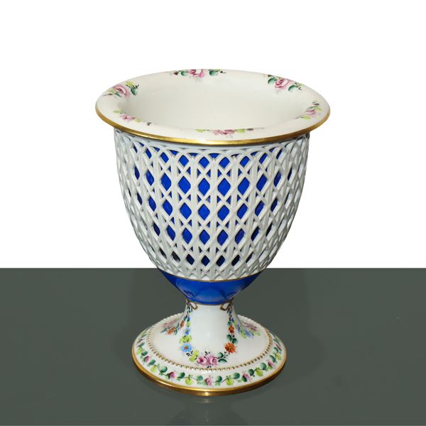 White basket porcelain vase with floral motif base with cobalt blue internal vase and floral motif rim