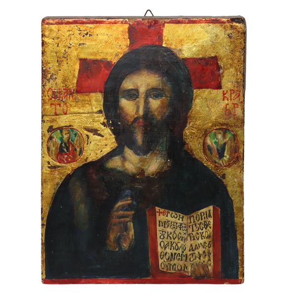 Russian icon depicting Christ Pantocrator with book and angels at the sides on a gold background