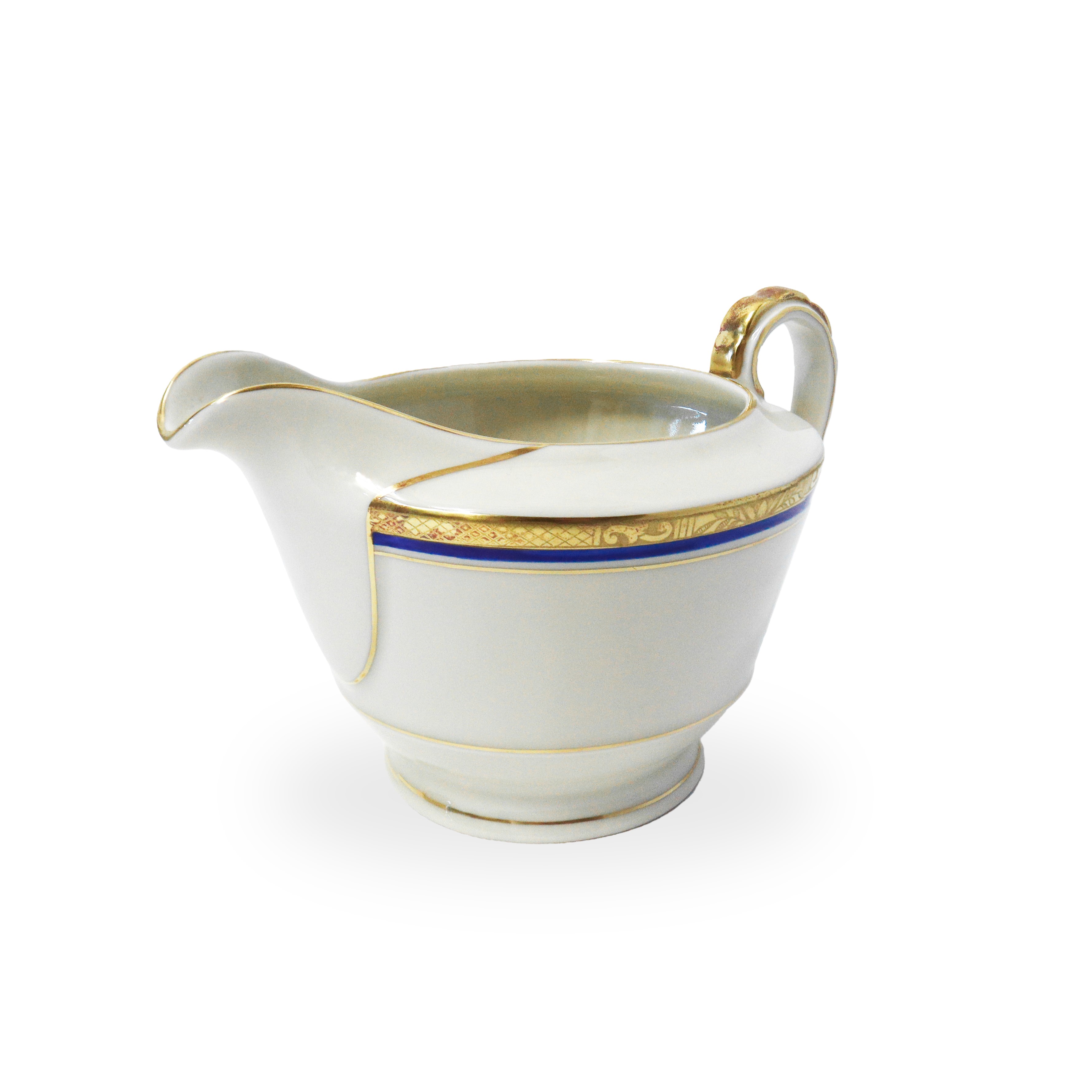 Servizio da tè in porcellana ecrù con riporti blu e dorati