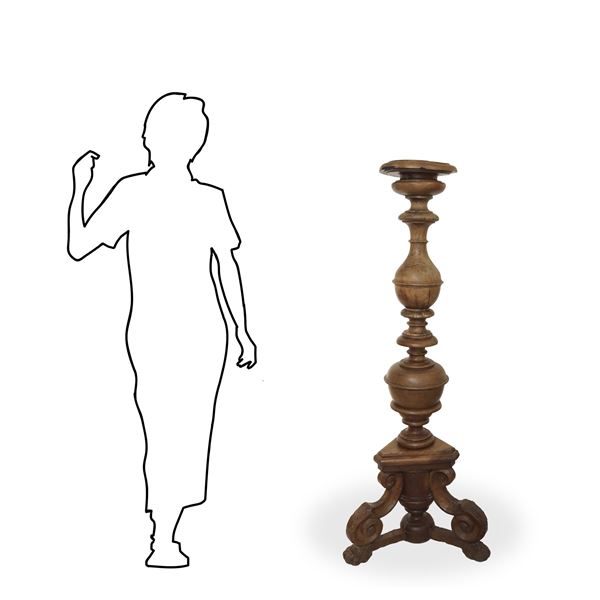 Large candlestick in walnut wood with large spools on a triangular base