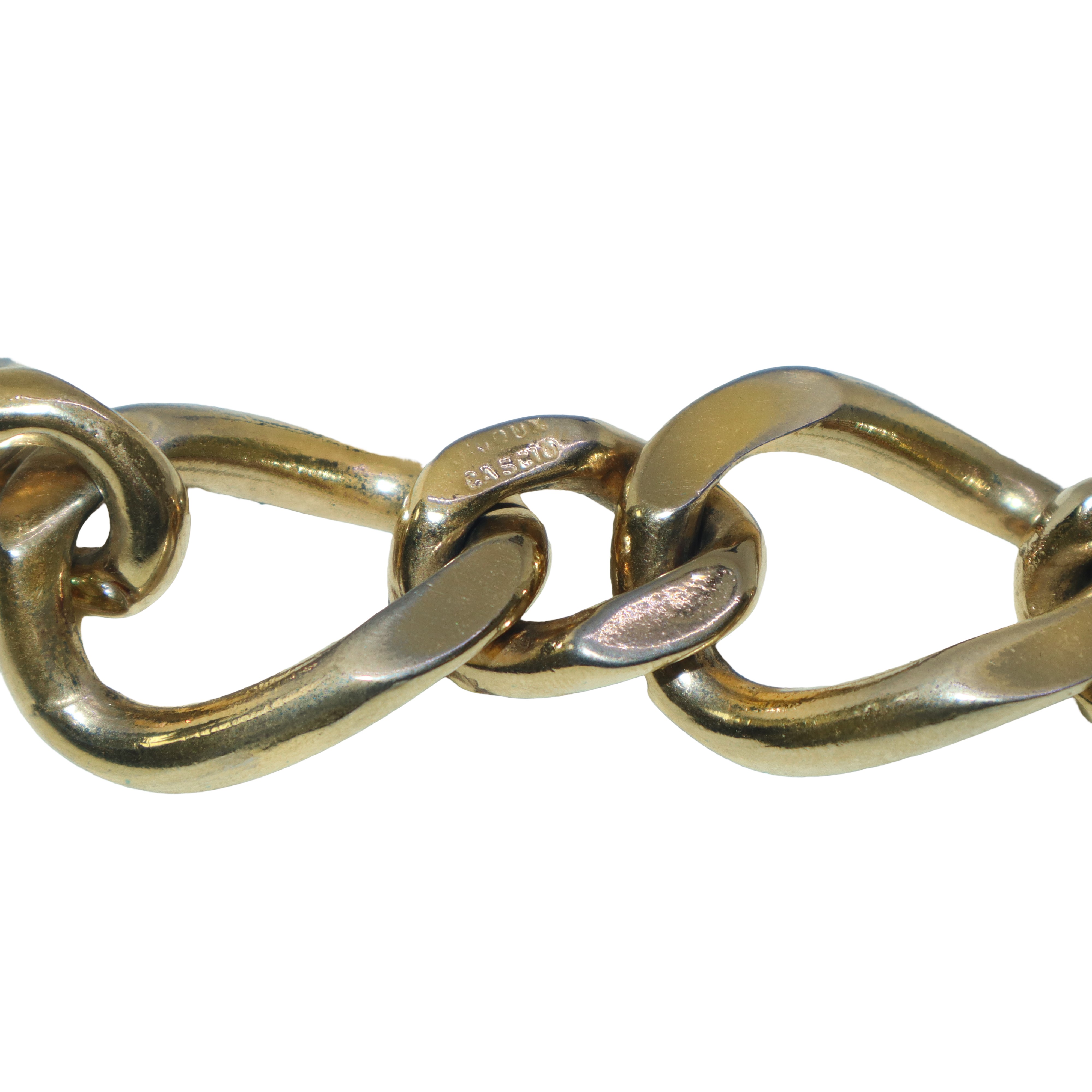 Bracciale a catena dorata con pietre rosse e strass