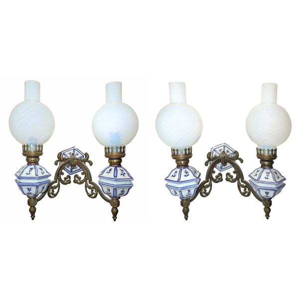 Pair of two-light wall lamps in white and blue majolica