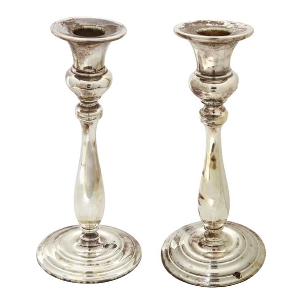 Pair of single-hole candle holders in silver