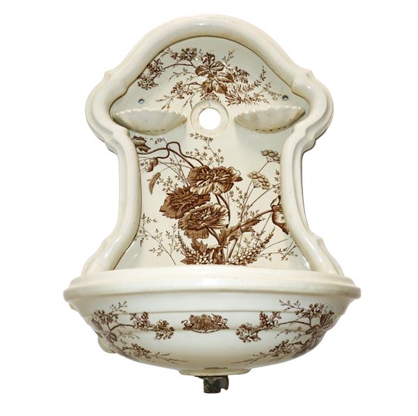 Majolica fountain painted with floral motifs