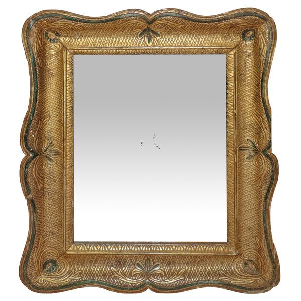 Mirror in gold leaf frame and tray mixture 