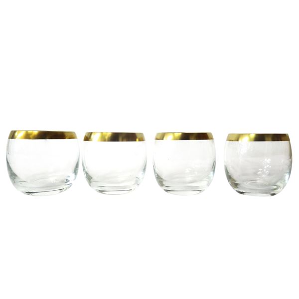 Four cocktail glasses in glass with gold rim