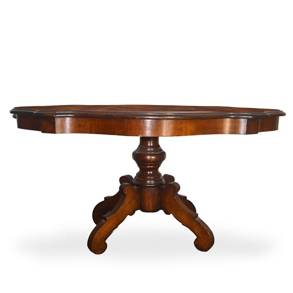 Low biscuit table with walnut root top threaded with light woods, four-spoke bowl-shaped foot