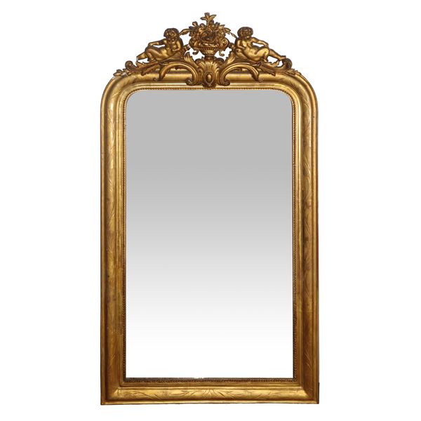 Louis Philippe gilded wooden mirror with a cymatium at the top and a carved ramage frame