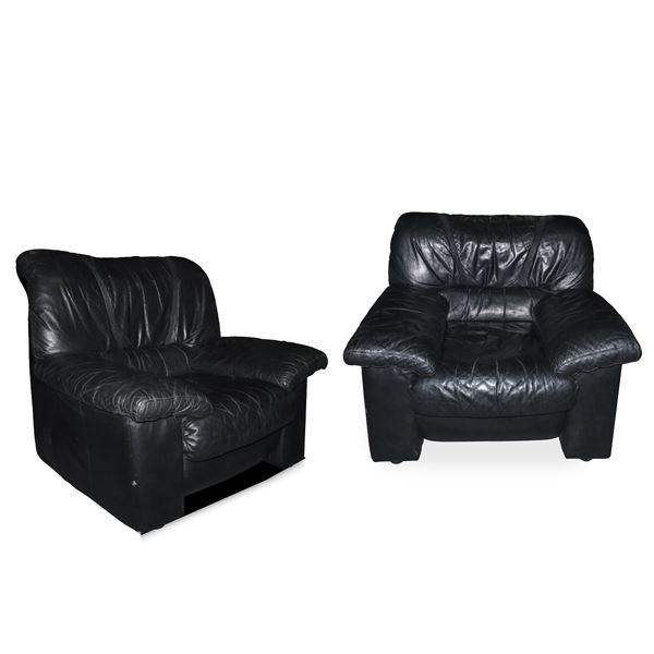 Pair of black leather armchairs