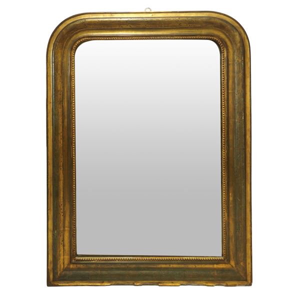 Mirror in gilded wood with engraved leaf