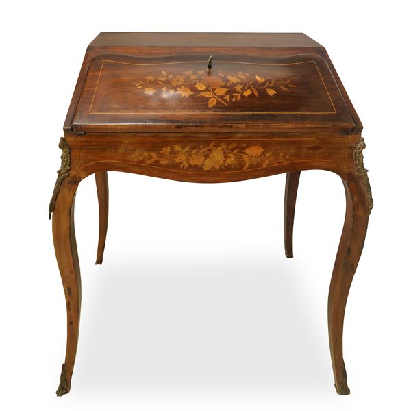 Mahogany desk with oblique flap with floral motif inlays in light woods with bronzes on the legs