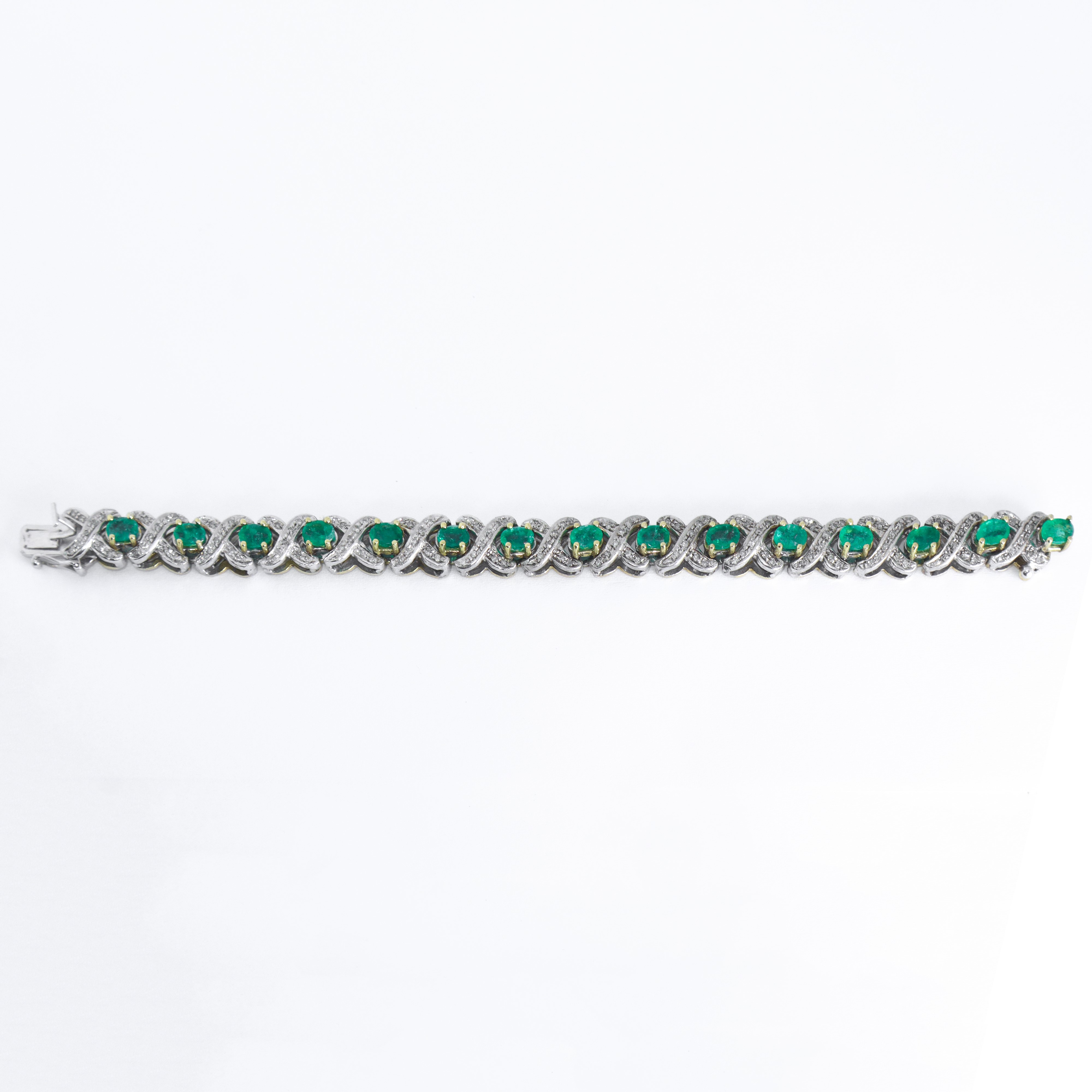 Bracciale tennis in oro bianco e oro giallo con diamanti e smeraldi