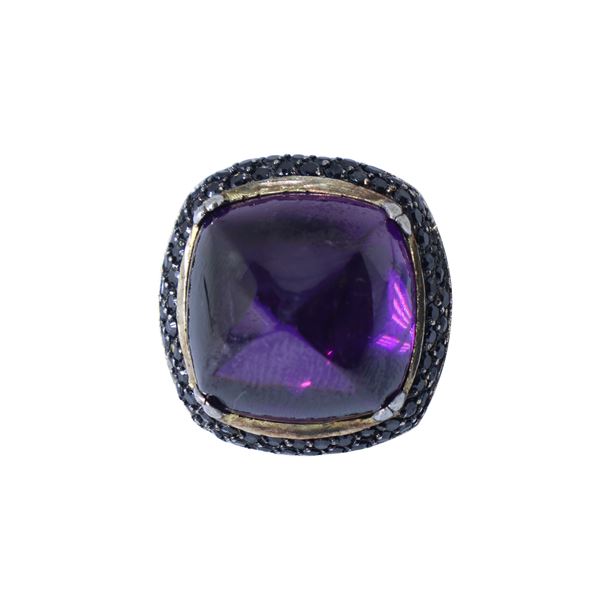 925 silver square ring with central purple stone and two rows of black stones around