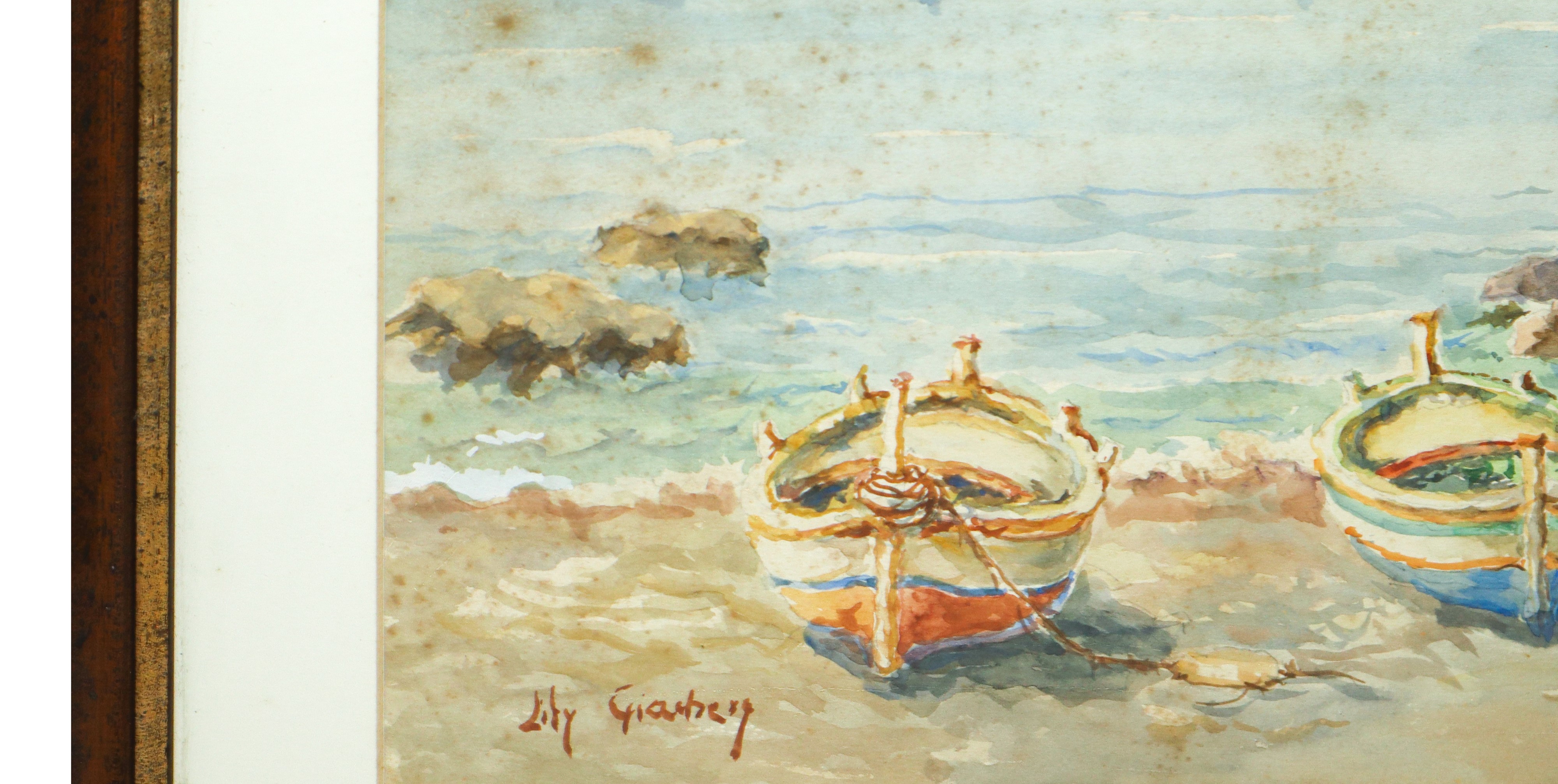 Faraglioni di acitrezza con barche a secco