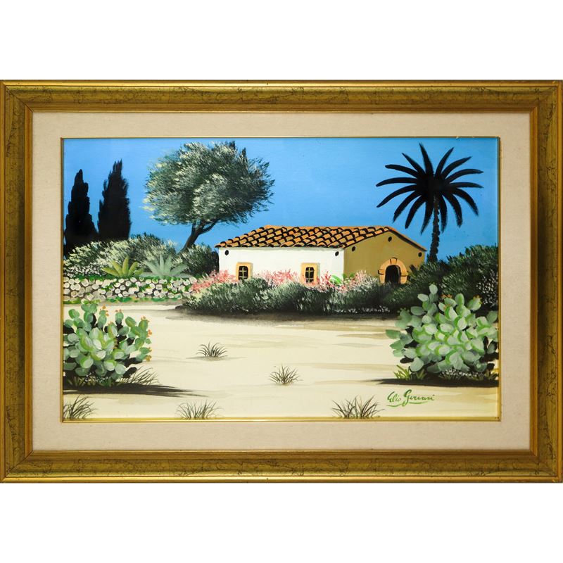 Casa con alberi e fichi d'india