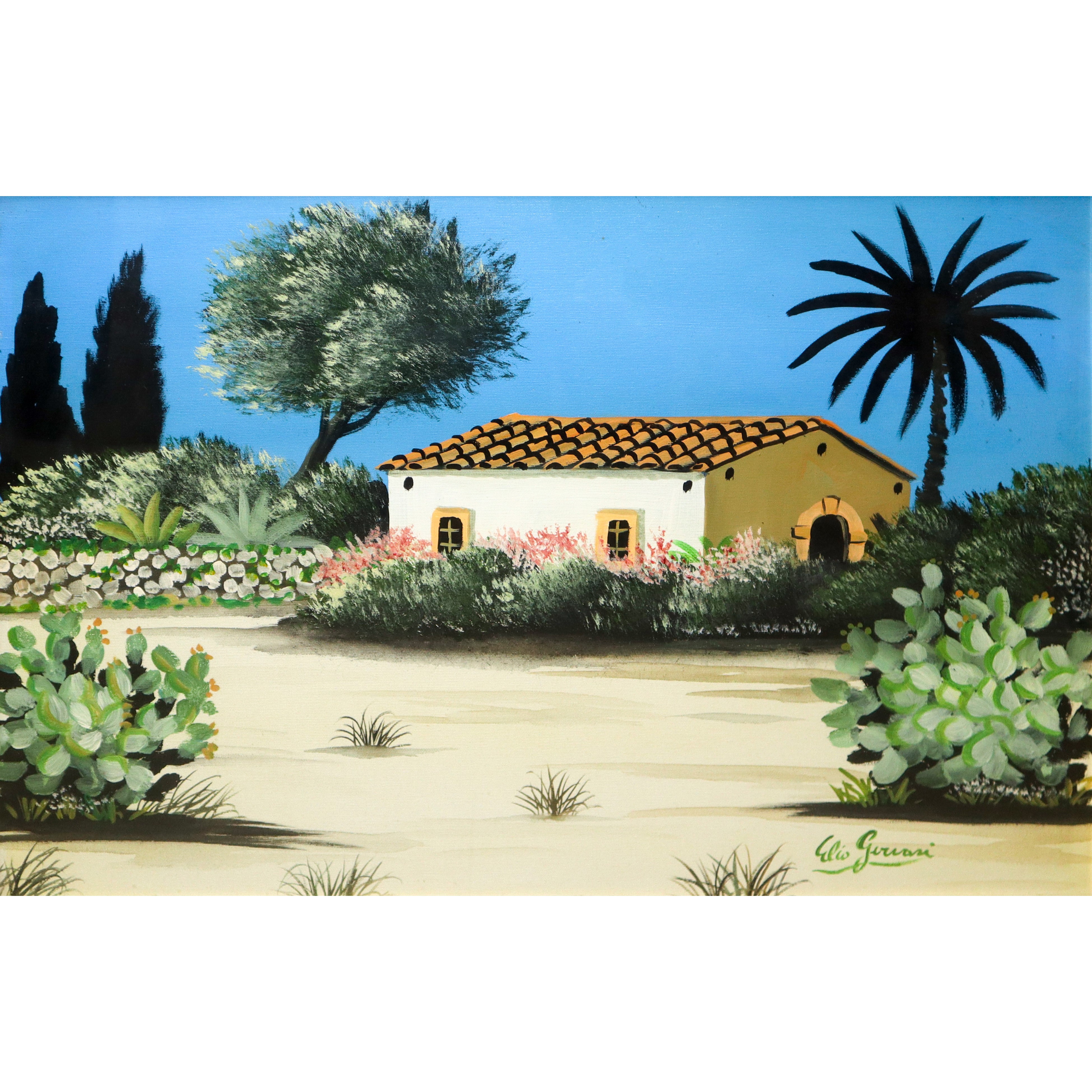 Casa con alberi e fichi d'india