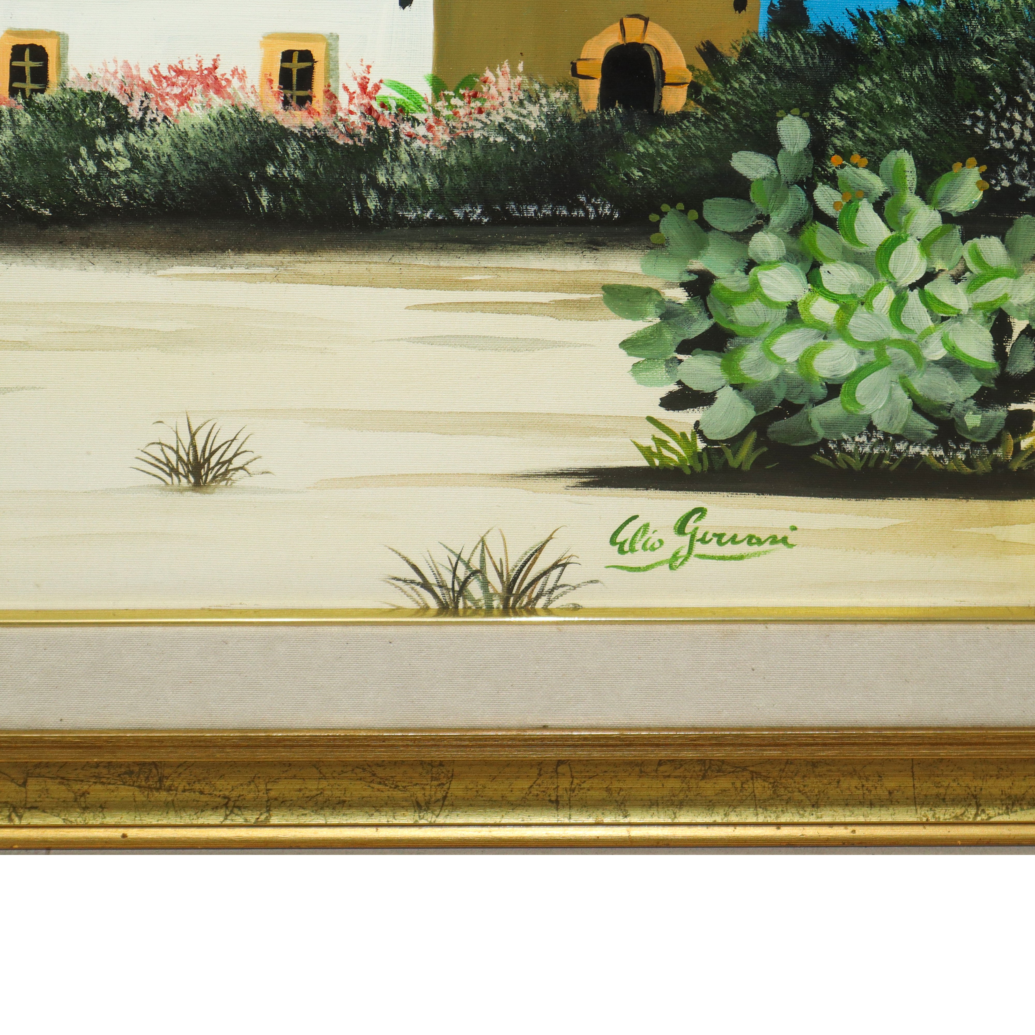 Casa con alberi e fichi d'india