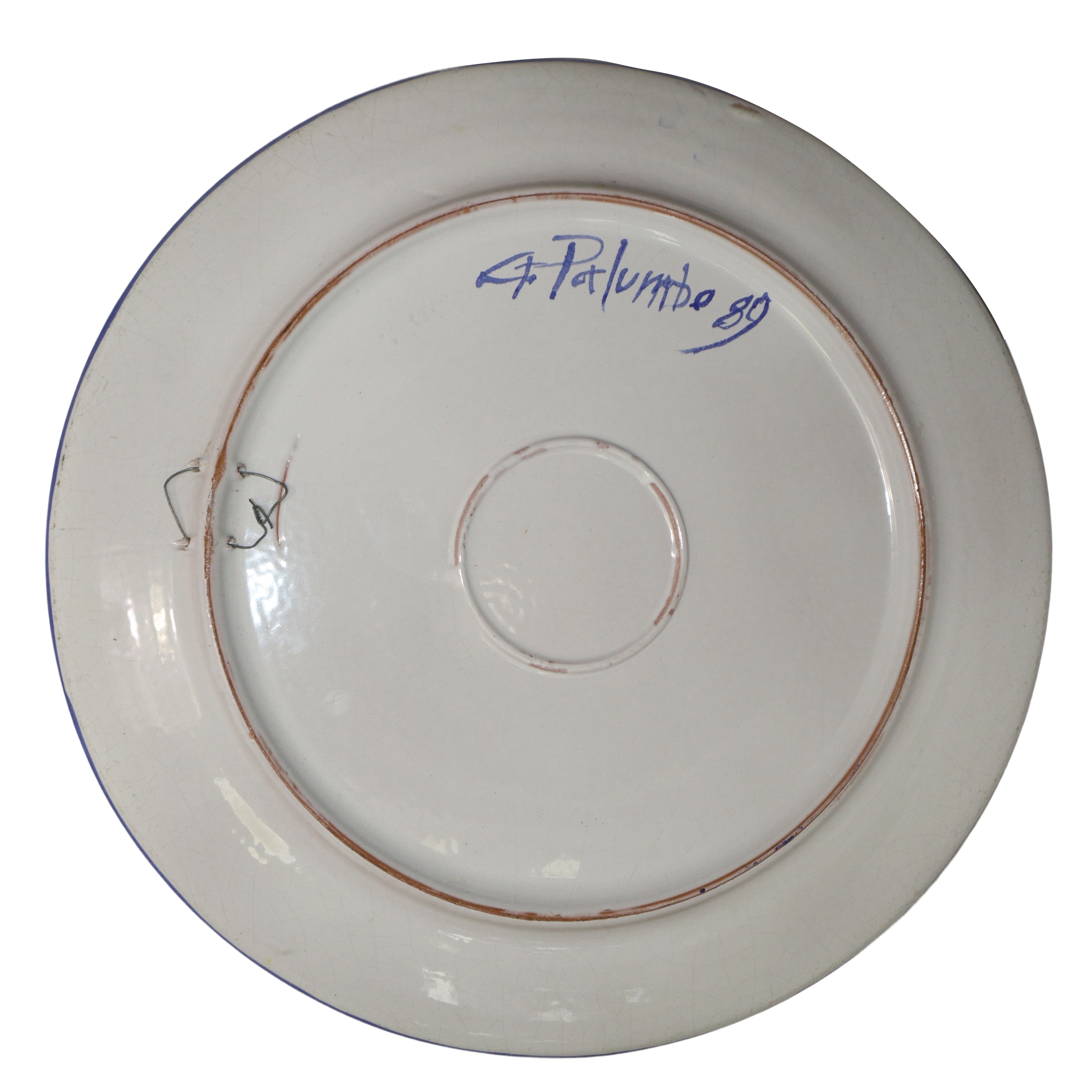 Piatto in maiolica nei toni del blu con raffigurazioni di girasoli