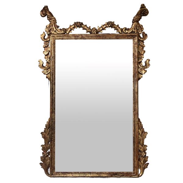 Mirror in a gilded wooden frame with round garlands