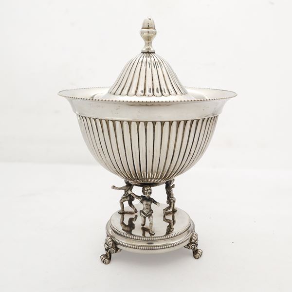 Sugar bowl with cherubs at the base