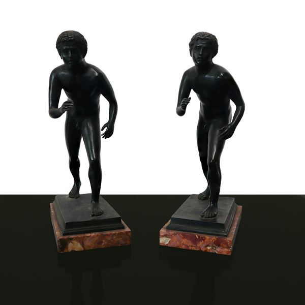 Bookends, sculptures of nudes depicting young athletes in black patinated bronze