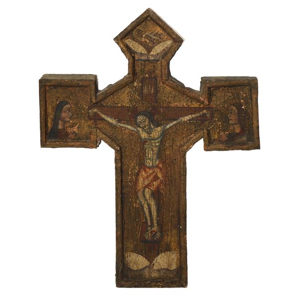 Ancient crucifix in fir wood painted with tempera