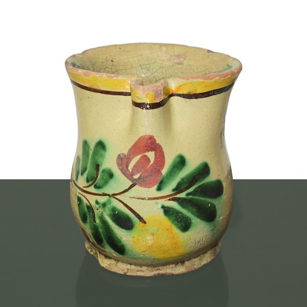 Caltagirone ceramic carafe decorated with flower on the front