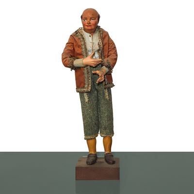 Personaggio presepiale napoletano del XIX secolo, terracotta e legno con vesti in cotone e passam...