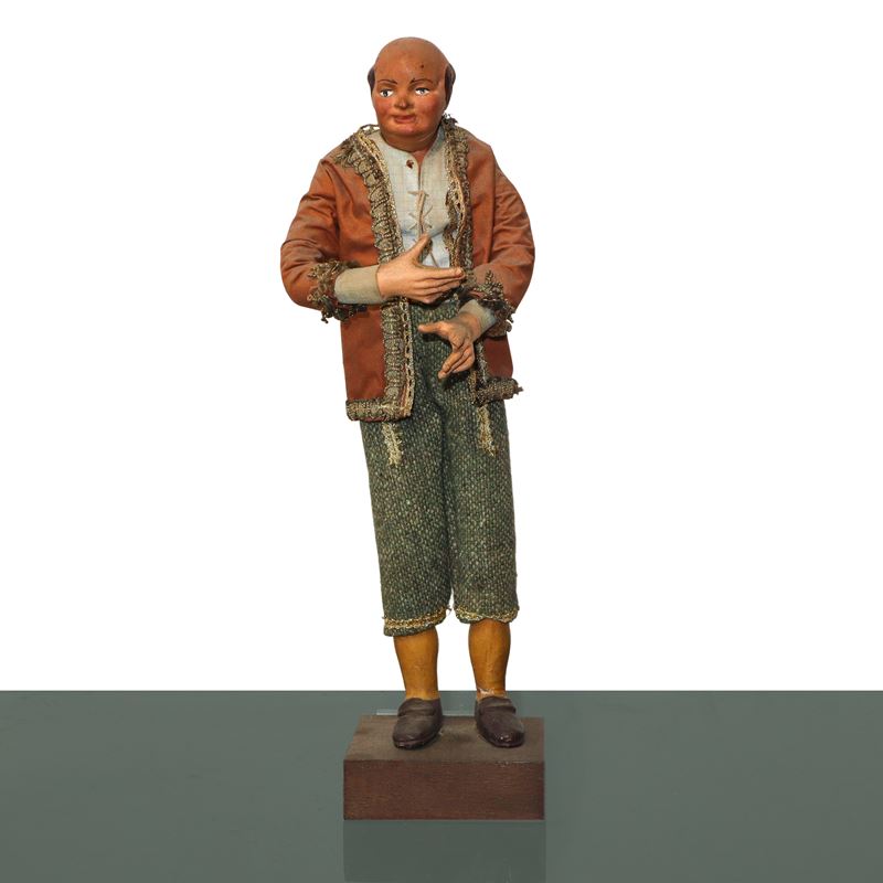 Personaggio presepiale napoletano del XIX secolo, terracotta e legno con vesti in cotone e passam...