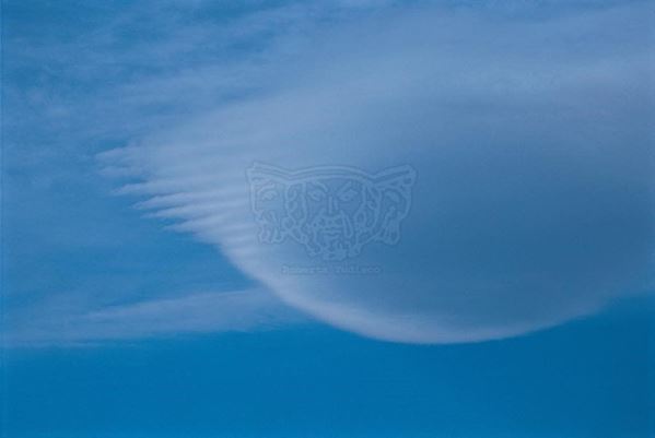 Collection EM, titled "Mothercloud", year 2001. Spain, Andalusia, semicircular cloud, Slide 1/8, 30x45, Cibachrome print directly from the slide, 40x55 forex 10mm, Contouring white, cardboard, cover edges volcanic sand