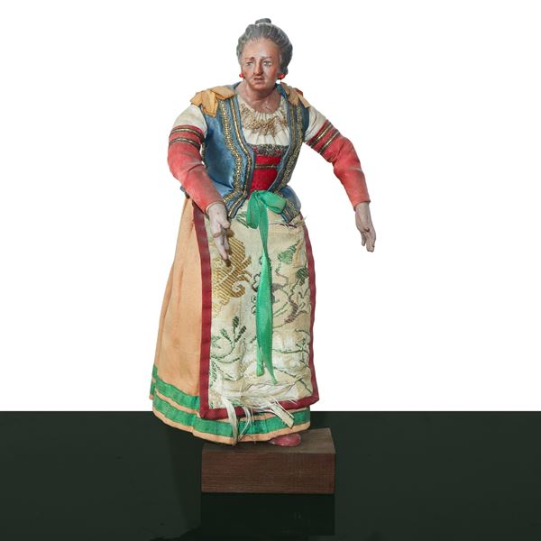 Personaggio presepiale in terracotta e legno con vesti in cotone, raso e passamaneria: popolana 