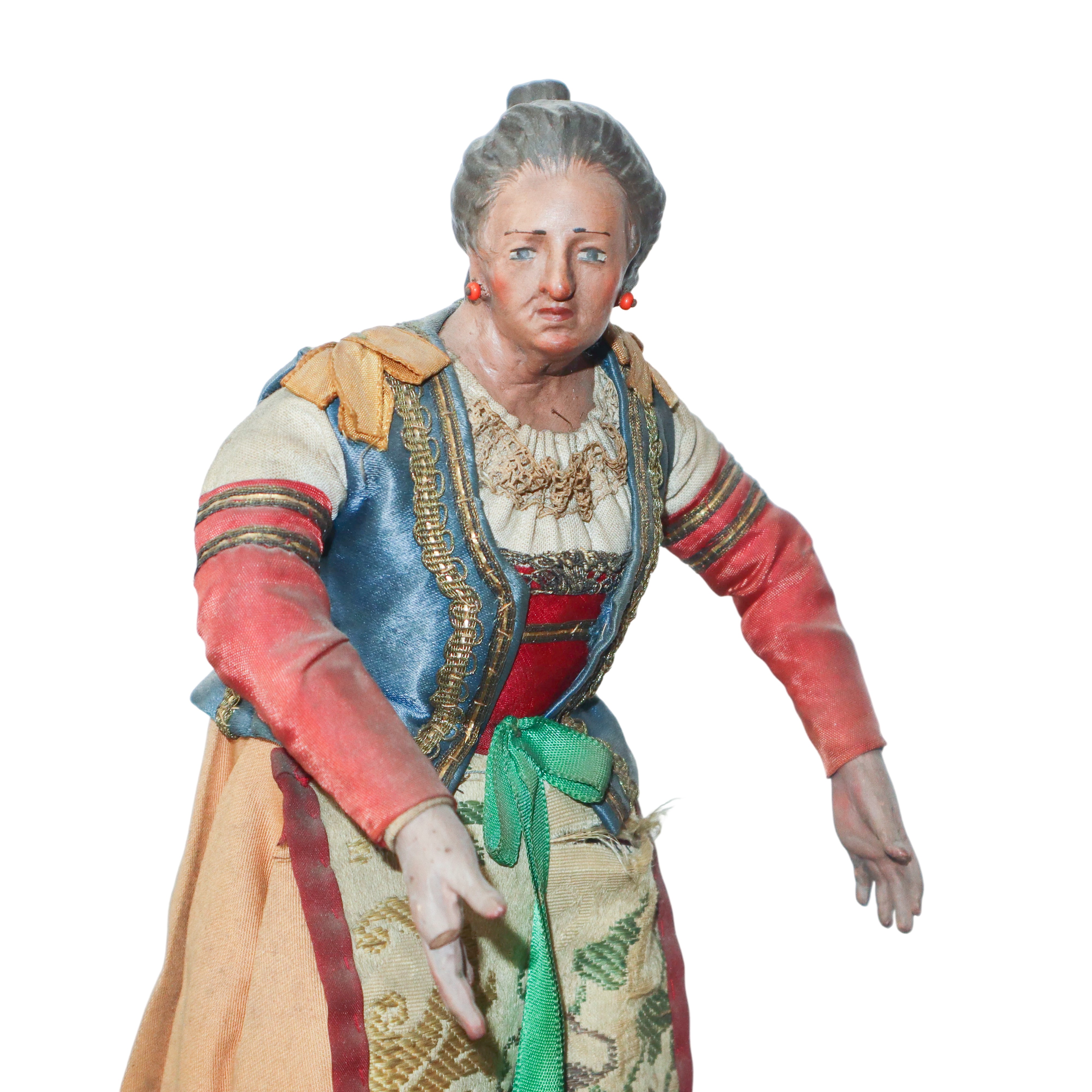 Personaggio presepiale, Napoli XIX secolo, terracotta e legno con vesti in cotone, raso e passama...