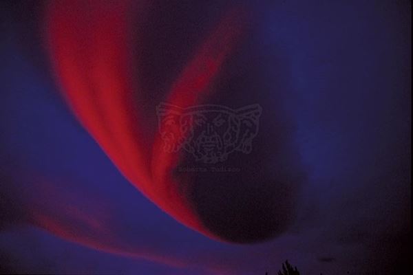 Collection EM title "Countess", 1999. Etna: cloud formation due to the meeting of the winds over the Valle del Bove (contention twenty) colored by sunset, slide 1/8, 30x45, Cibachrome print directly from the slide, 40x55 forex 10mm, Contouring white, cardboard, cover edges volcanic sand