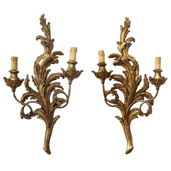Pair of two-light gilded wooden wall lamps
