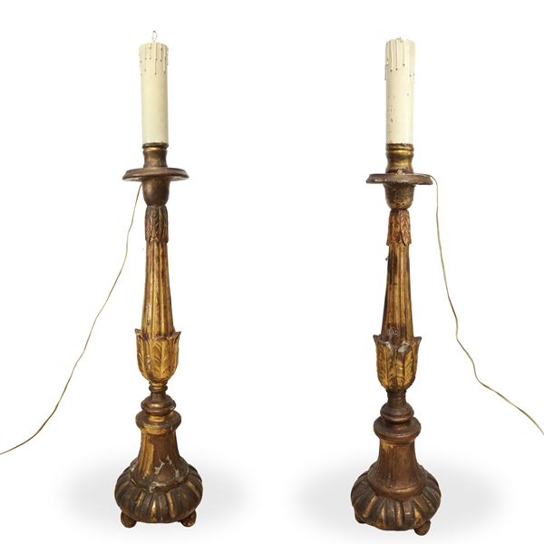 Pair of gilded wooden candlesticks