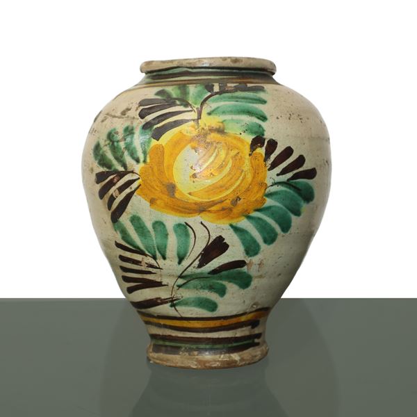 Caltagirone majolica vase decorated and glazed with yellow-green flower