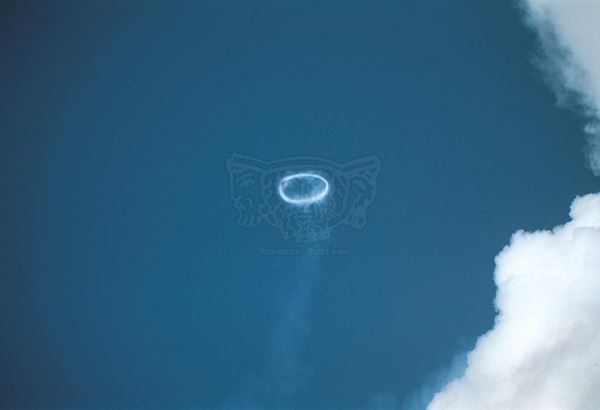 Collection EM, titled "Smokering", year 1998. Etna: ring of smoke produced from the crater of the south east, slide 1/8, 30x45, cibachrome slide by direct printing, 40x55 forex 10mm, Contouring white, cardboard, cover edges volcanic sand