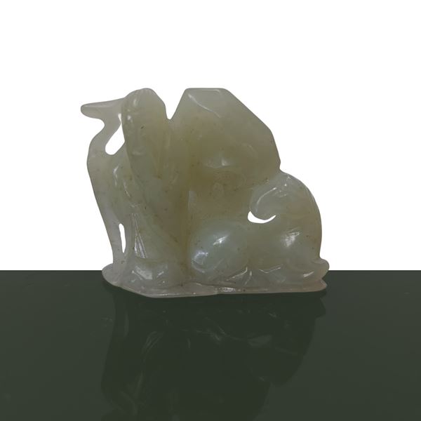 Old sage with green jade lucky ornament