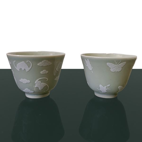 Small bowls with white butterfly decorations in relief