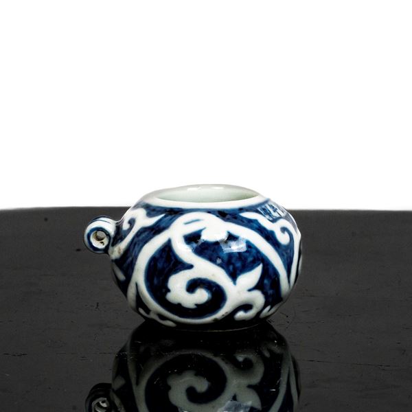 Small white porcelain bird food jar with blue decorations and inscriptions