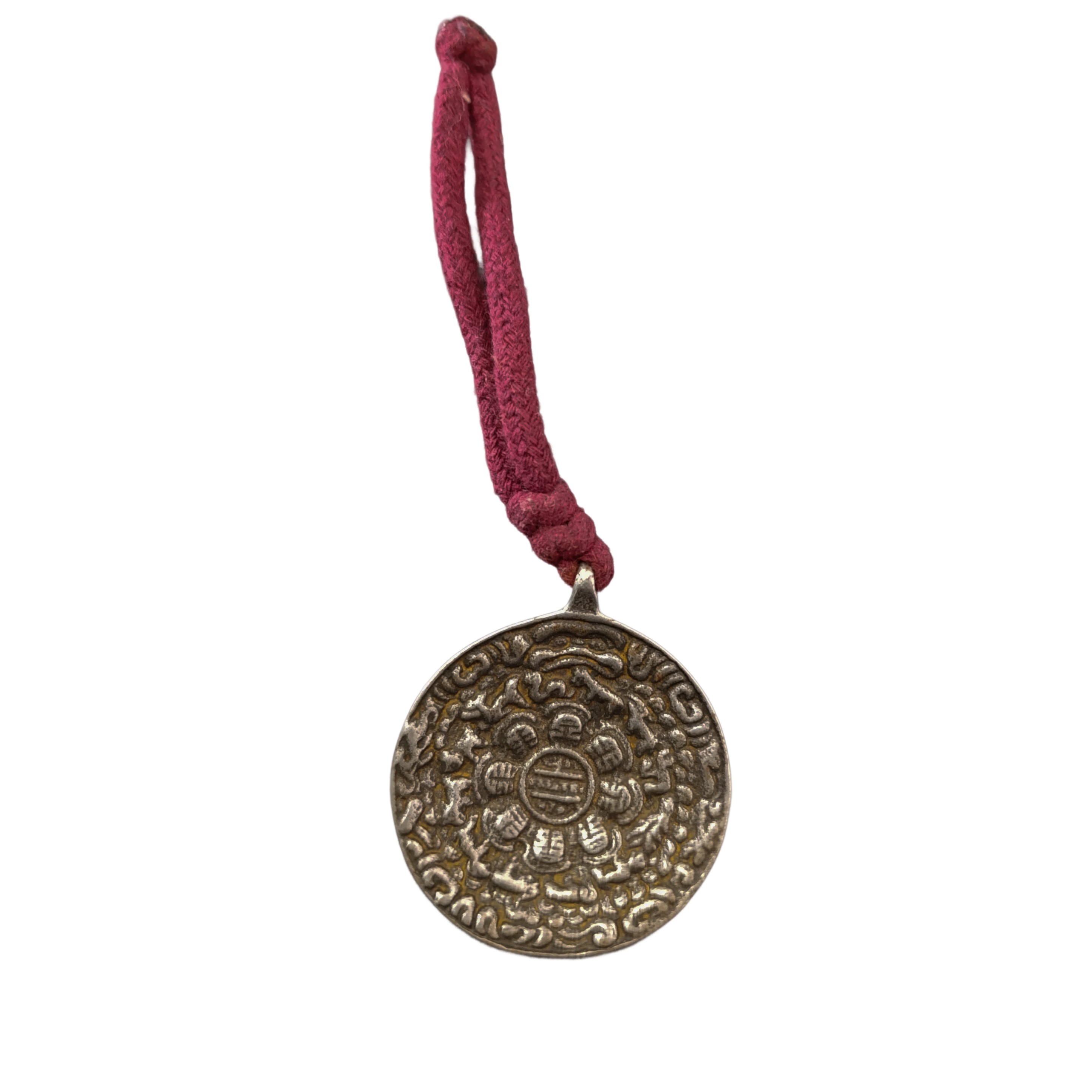 Coppia di amuleti rotondi in rame tibetano