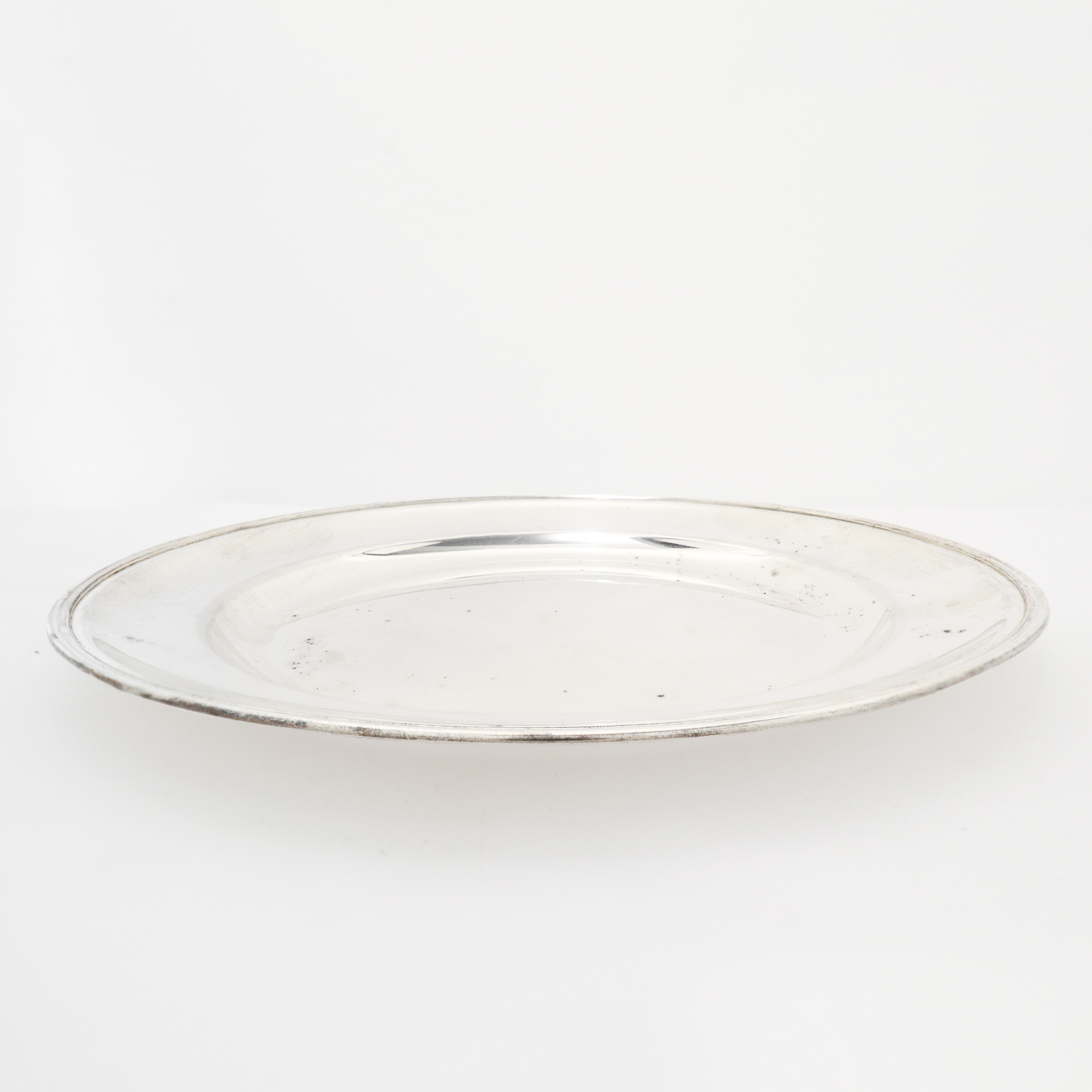 Piatto centrotavola in argento 800 st