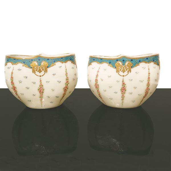 Pair of vases decorated with flowers and gold.