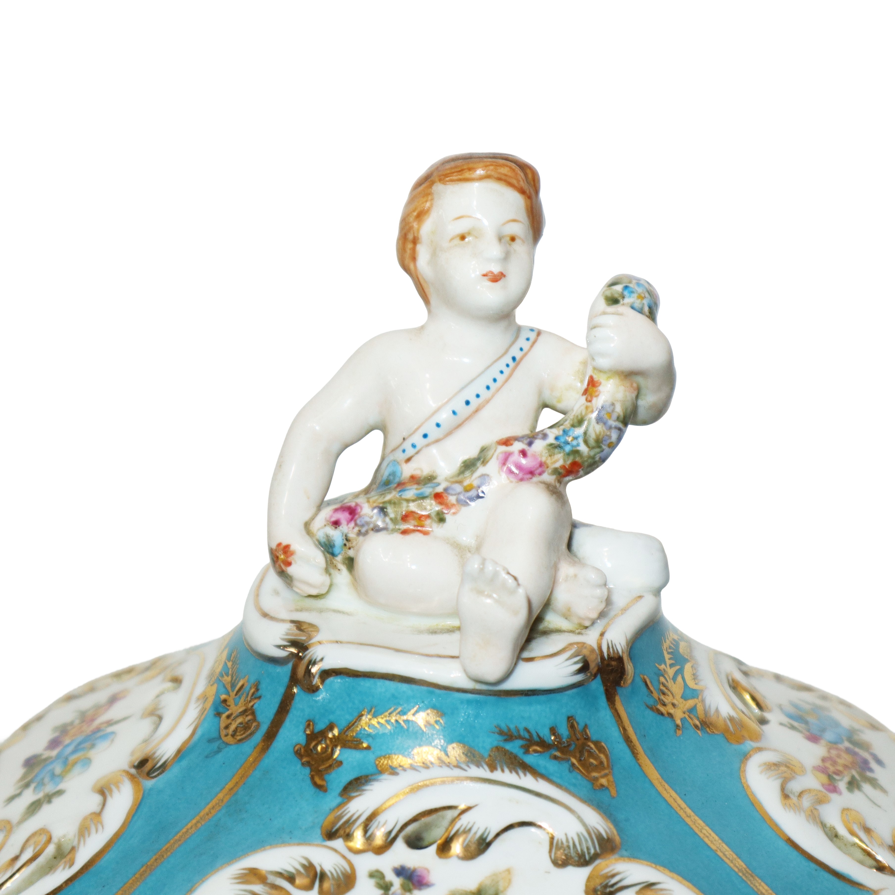 Coppia di poutiche in porcellana coperchio con amorino policromo su base bianca e turchese con de...