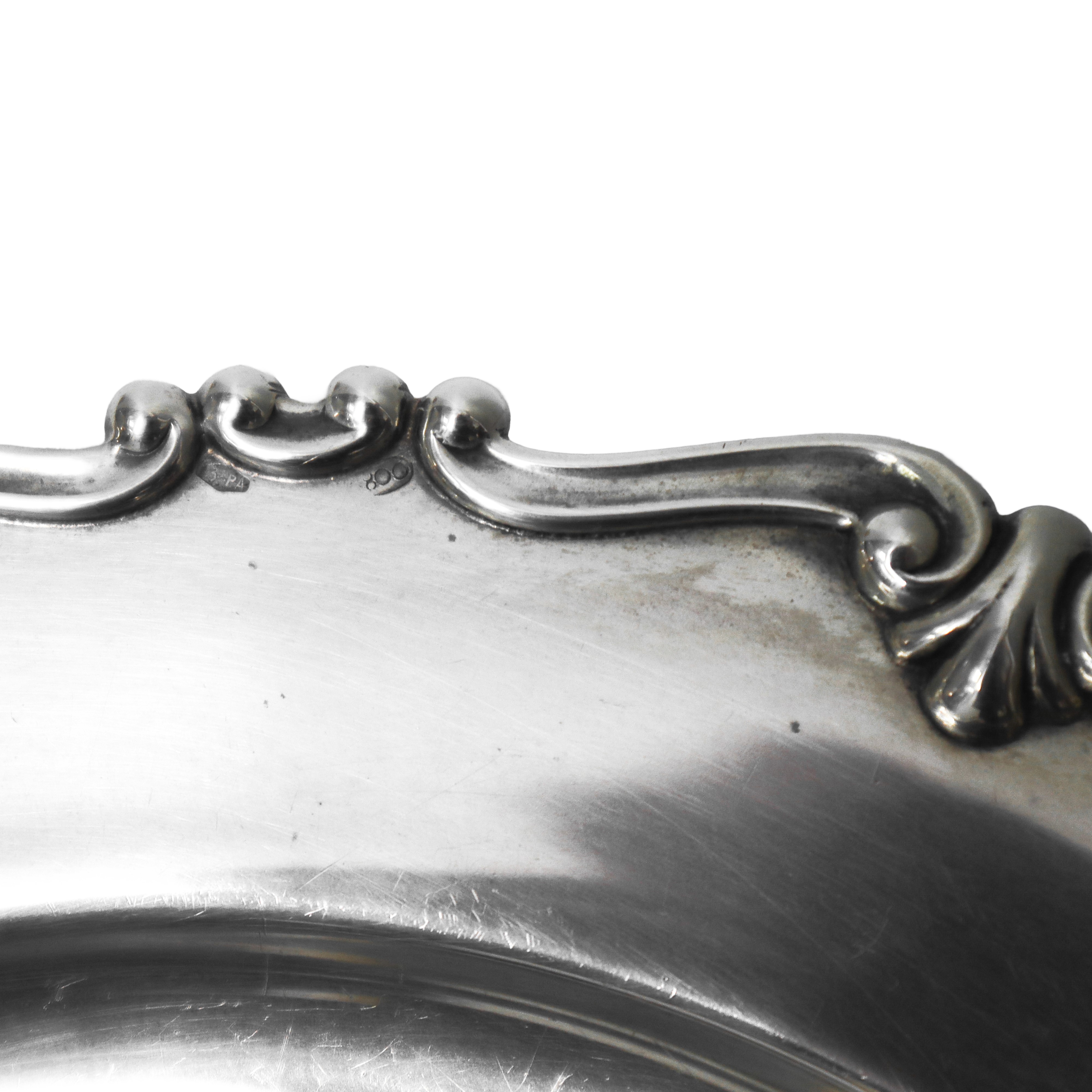 Piatto rotondo in argento 800 con bordo smerlato